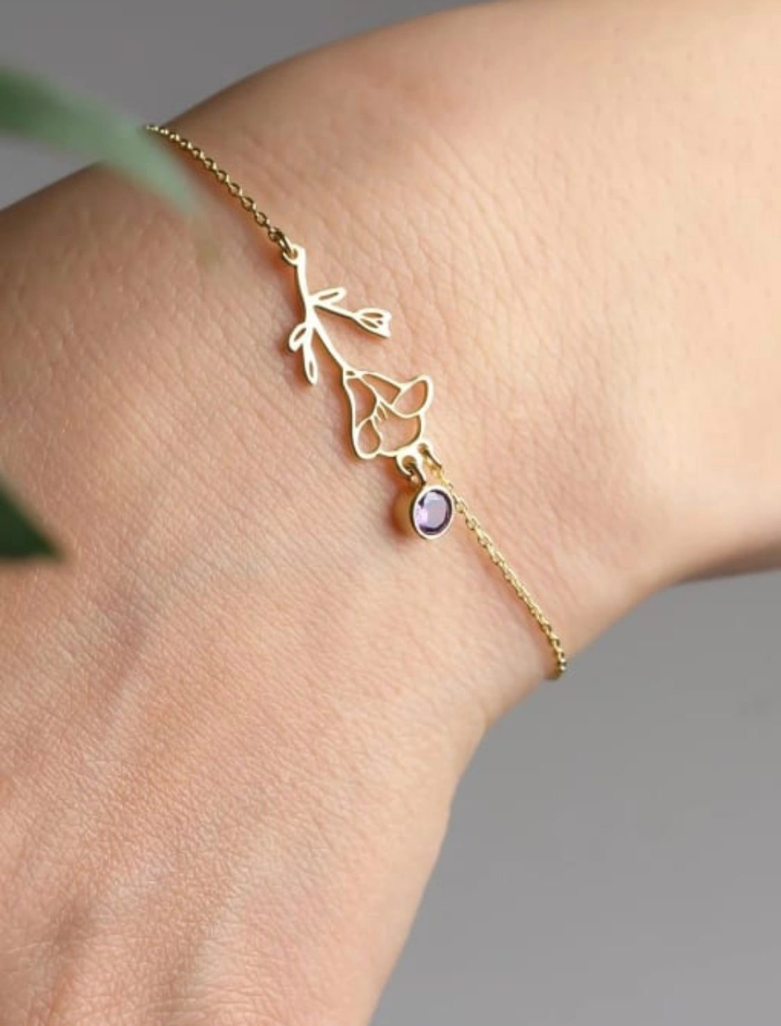 Sparkling gold bracelet with rose design and amethyst stone 7”